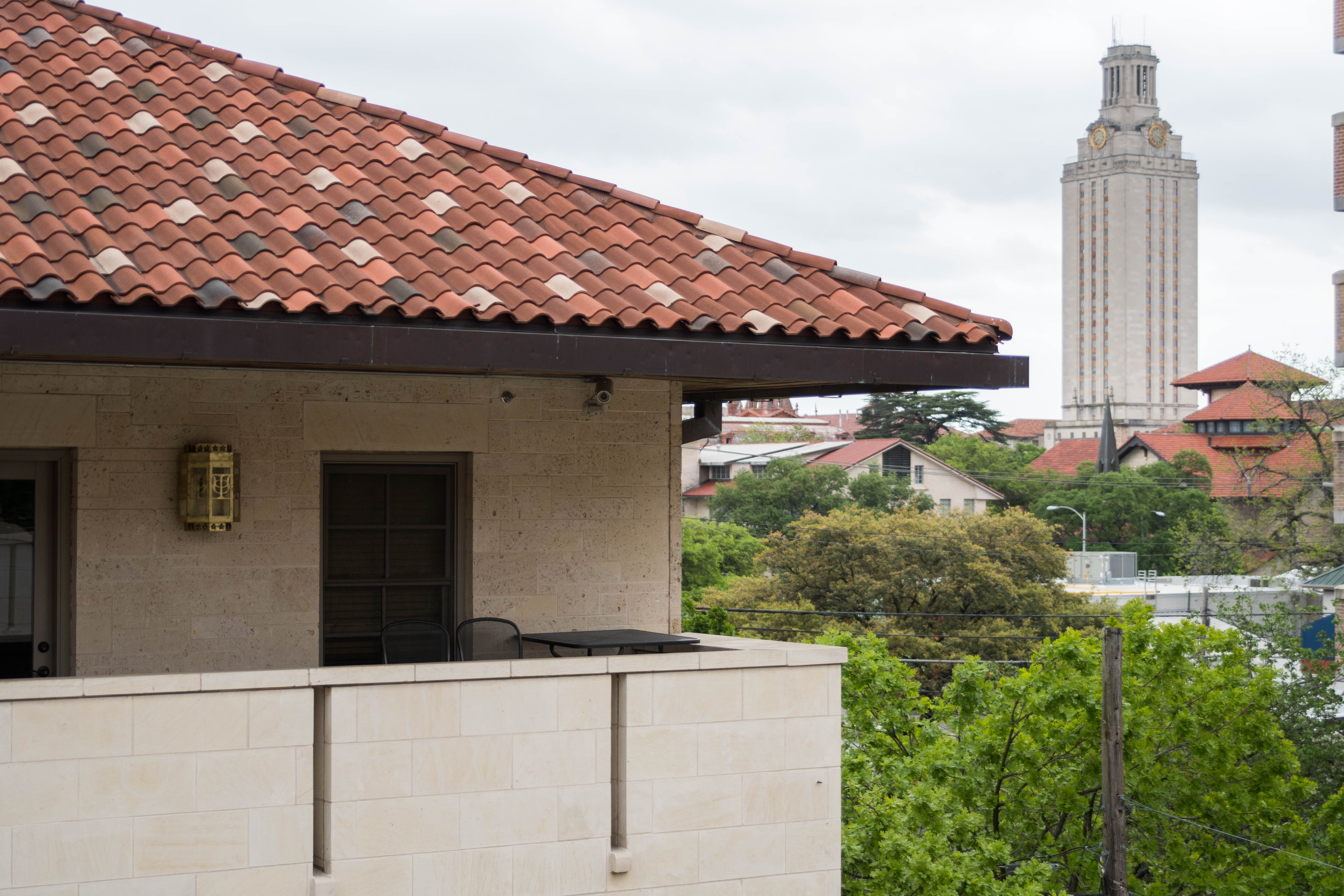 The Texas Alpha chapter house with the UT Tower in the distance